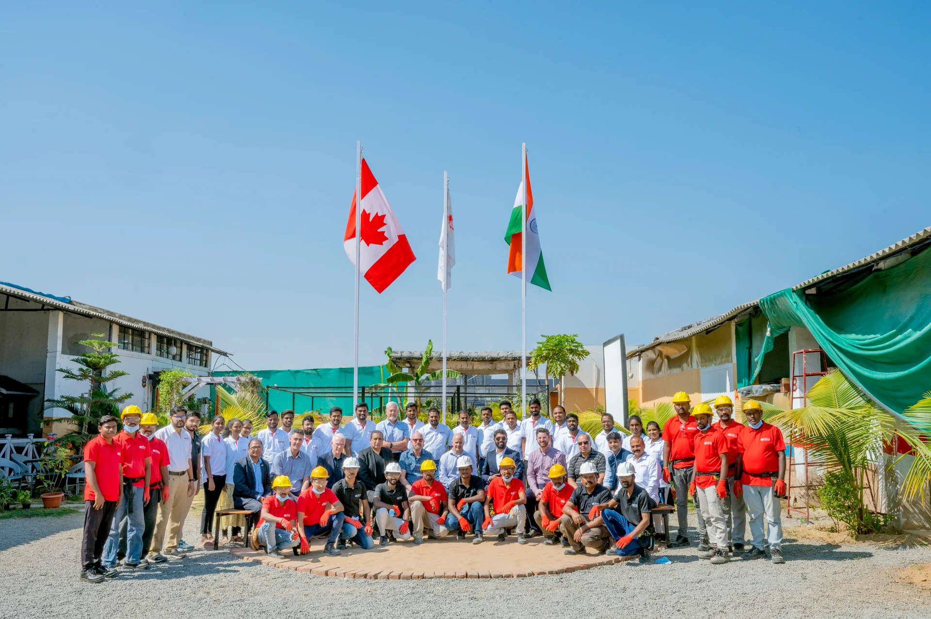 The Nesca team gathered outside their workplace; the complete group is shown